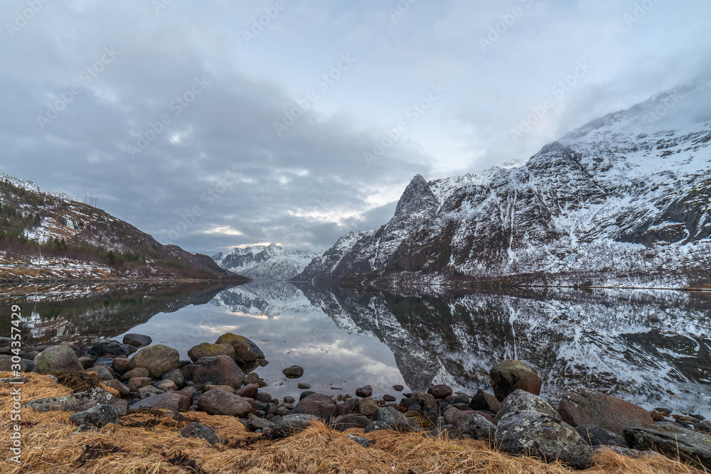 beautiful sunset under blue hour over fjord in Lofoten islands, Norway. beautiful sunset under blue hour over fjord in Lofoten islands, Norway.