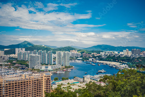 Canvas Print Top View of Hainan's Sanya City, with local houses and luxury hotels and buildings
