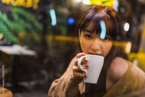 View of Cute young girl through window glass