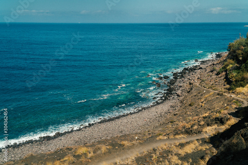View of the black beach Playa de Guayedra in Las Palmas on Gran Canaria volcanic island, Spain, Atlantic ocean, volcanic rocks © Kuma Media