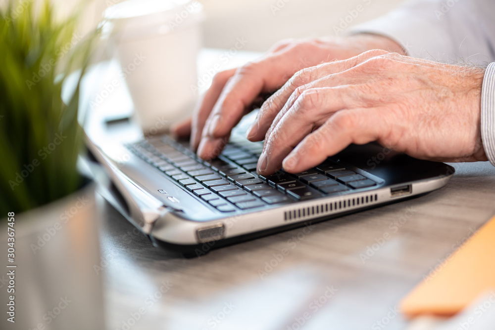 Hands typing on laptop keyboard Hands typing on laptop keyboard