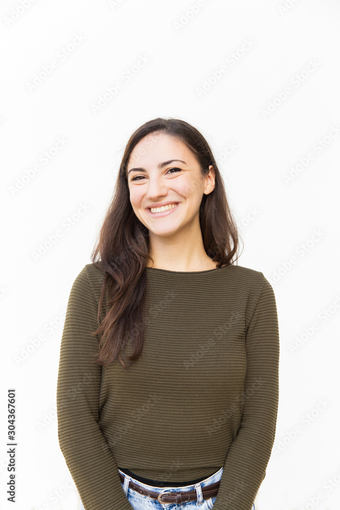 Happy joyful Latin woman posing for camera, smiling and laughing. Young woman in casual standing isolated over white background. Good news or positive emotions concept Happy joyful Latin woman posing for camera, smiling and laughing. Young woman in casual standing isolated over white background. Good news or positive emotions concept