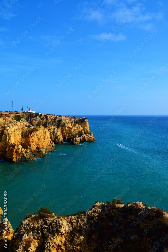 Boat with tourists on the coast of Lagos Portugal 01.Nov.2019