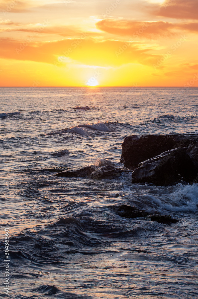 Naklejka premium Caspian Sea at sunset. Rocky coast.