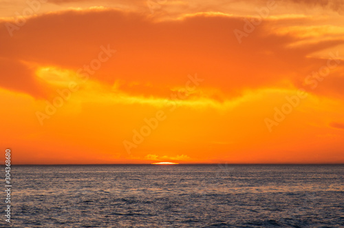 Caspian Sea at sunset. The sun sets in the water.