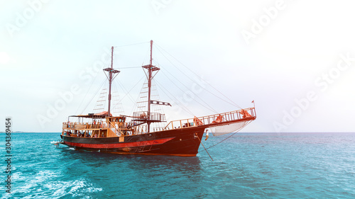 old wooden ship in the blue ocean, sea cruise on a wooden schooner
