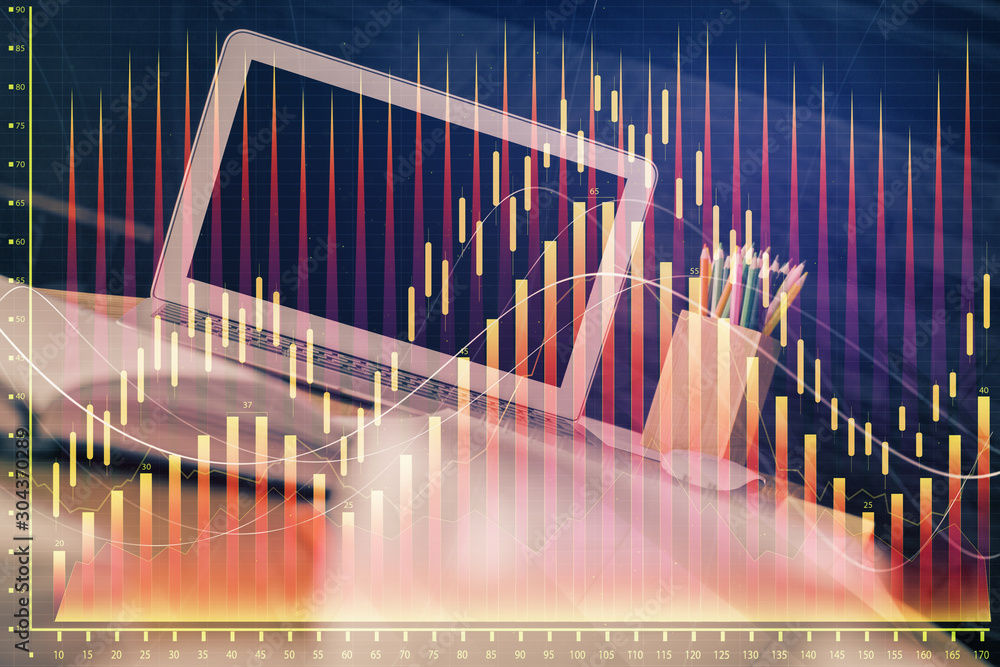 Financial chart drawing and table with computer on background. Multi exposure. Concept of international markets. Financial chart drawing and table with computer on background. Multi exposure. Concept of international markets.
