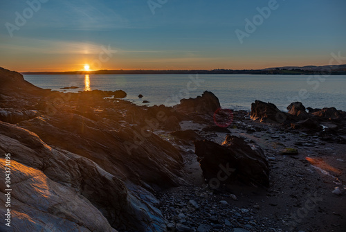Sunset over rocky beach in Cornwall © Nathaniel