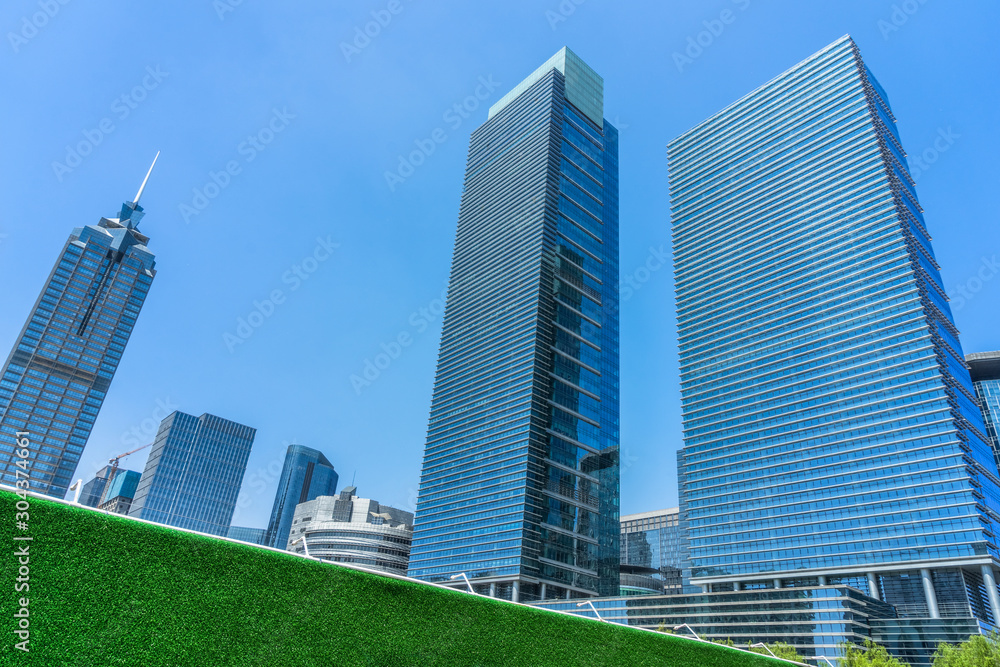 Fototapeta premium low angle view of skyscrapers in city of China.