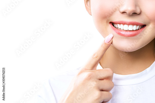 Perfect healthy teeth smile of a young woman. Teeth whitening. Dental clinic patient. Image symbolizes oral care dentistry, stomatology. Isolate en white backround. photo