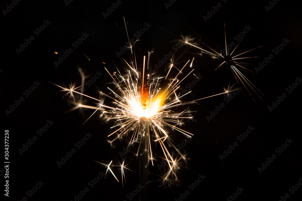 Bengal fire sparkles isolated on black background 