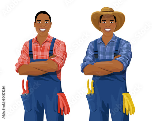 Cartoon African American farmer wearing checkered shirt, overall and hat stands with arm crossed. Smiling gardener with work gloves and hand pruners in his pocket. Vector isolated on white background.