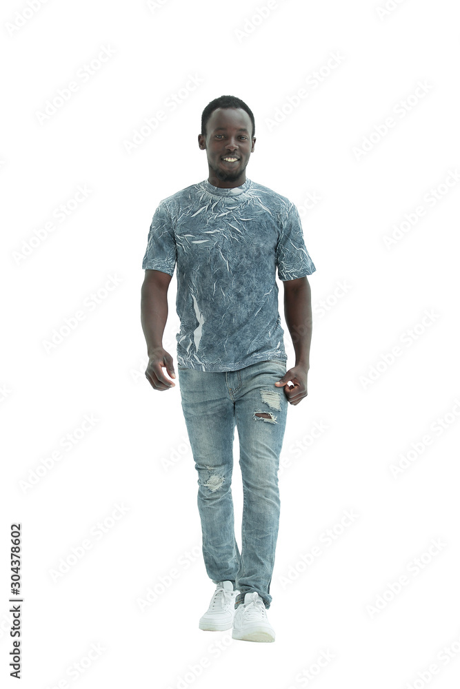 Fototapeta premium in full growth. smiling guy in stylish jeans.