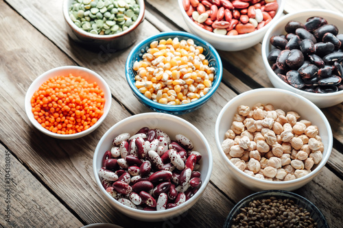 Super food. Seeds and beans assortment on a rustic background copy space. Vegetarians..