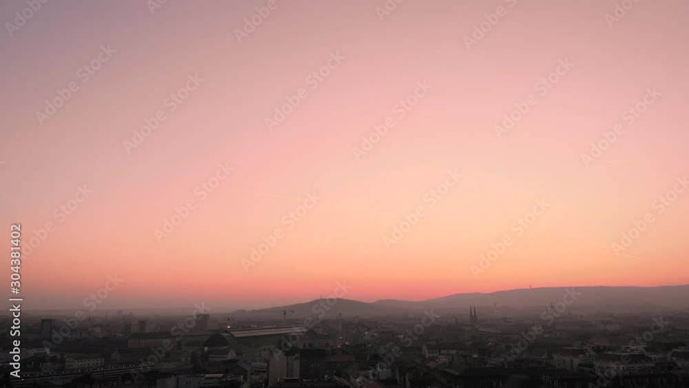 Pink sunset over a city, slowly panning to the left, big copy space for editing. Pink sunset over a city, slowly panning to the left, big copy space for editing.
