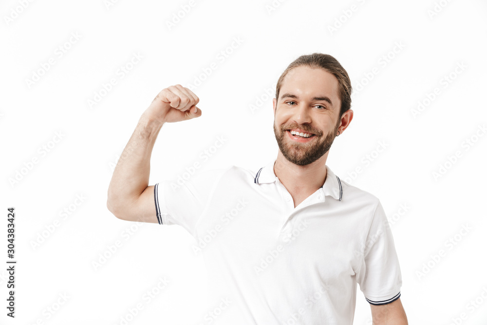 Bearded man posing isolated showing biceps. Bearded man posing isolated showing biceps.