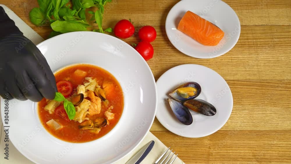 Sicilian tomato seafood soup. Soup with mussels and fish. Beautiful dish Sicilian tomato seafood soup. Soup with mussels and fish. Beautiful dish