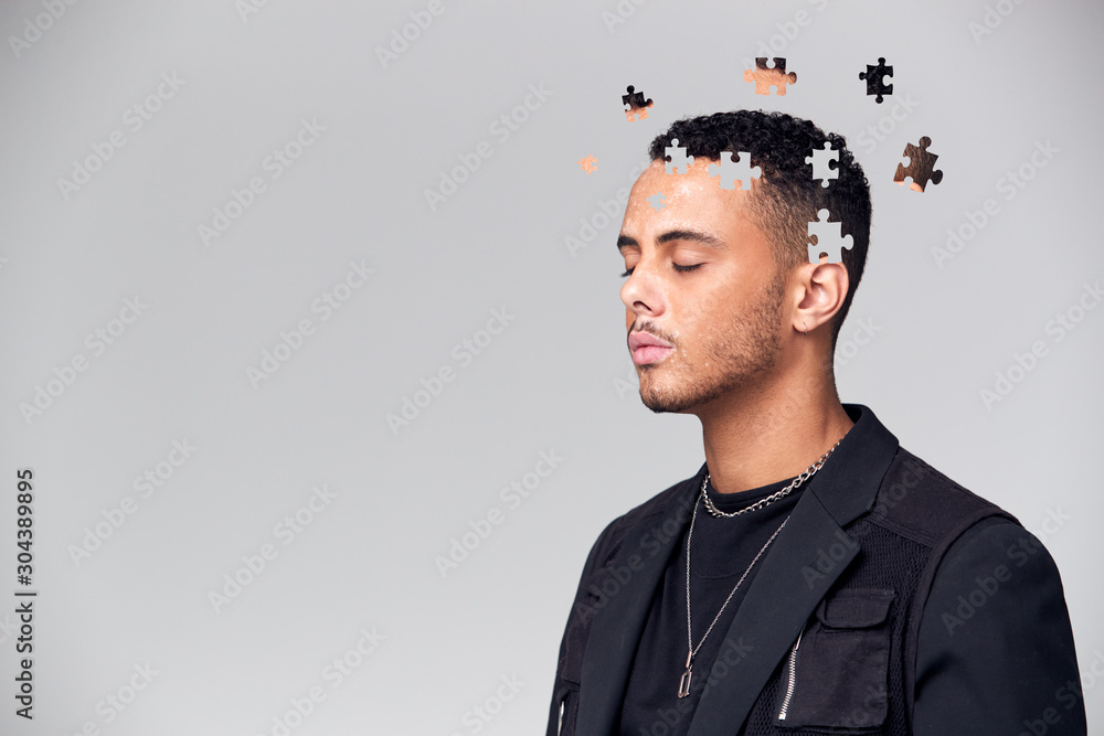 Obraz premium Mental Health Concept Of Young Man With Jigsaw Shaped Pieces Missing From Mind