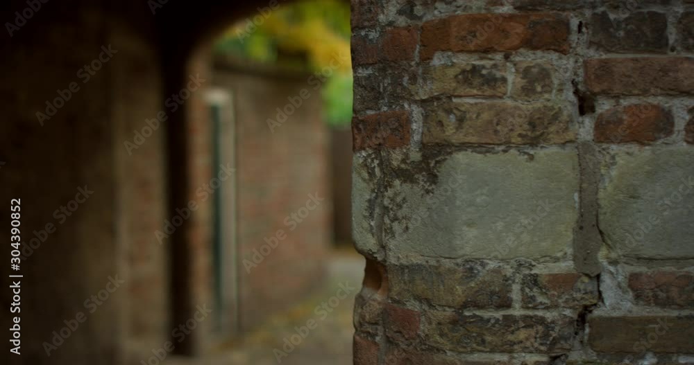 Small alleyway leading to the historical street Kuiperspoort in Middelburg. Small alleyway leading to the historical street Kuiperspoort in Middelburg.