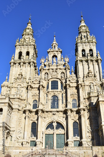 Cathedral, baroque facade and towers from Plaza del Obradoiro with blue sky. Santiago de Compostela, Spain. © JB