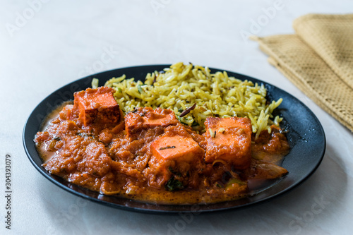 Indian Food Paneer Butter Tikka Masala / Cheese Cottage Curry and Jeera Zira Rice Basmati Pilaf or Pilav.