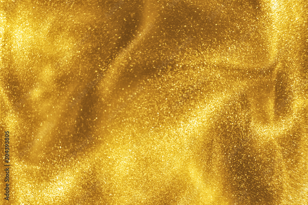 Abstract elegant, detailed gold glitter particles flow with shallow depth of field underwater. Holiday magic shimmering luxury background. Festive sparkles and lights. de-focused. - obrazy, fototapety, plakaty 