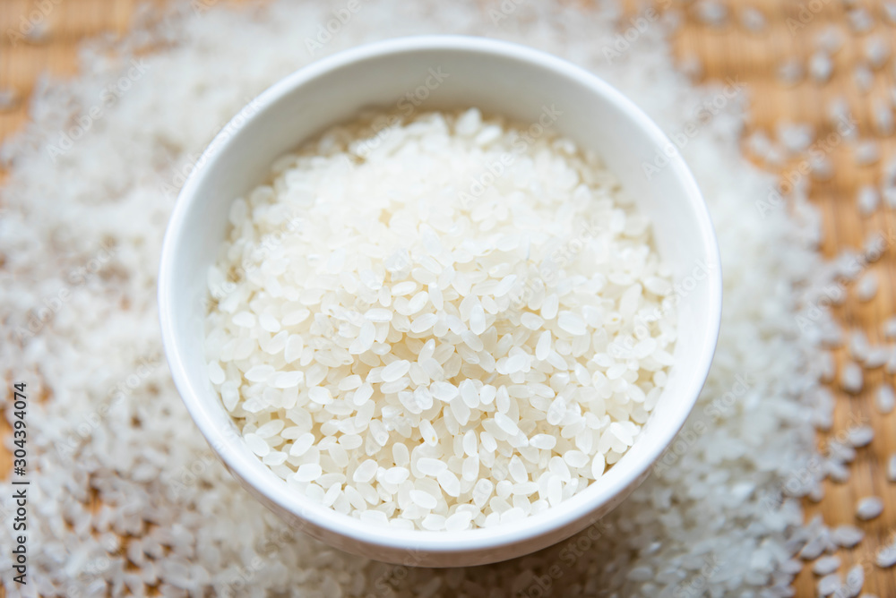 Beautiful japanese rice on japanese mat,round rice grain Beautiful japanese rice on japanese mat,round rice grain