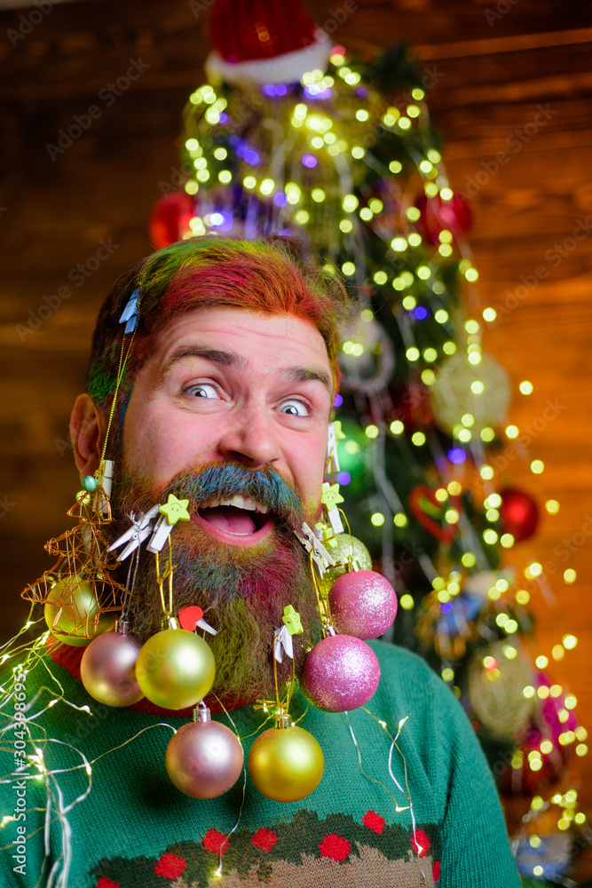 Cheerful bearded man with decorated beard. New year party. Christmas beard decorations. Winter holidays. Decorated beard. Bearded man with decorated beard. Christmas decoration. Christmas holidays. Cheerful bearded man with decorated beard. New year party. Christmas beard decorations. Winter holidays. Decorated beard. Bearded man with decorated beard. Christmas decoration. Christmas holidays.