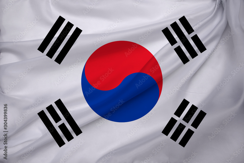 photo of the beautiful colored national flag of the modern state of South Korea on textured fabric, concept of tourism, emigration, economic photo of the beautiful colored national flag of the modern state of South Korea on textured fabric, concept of tourism, emigration, economic