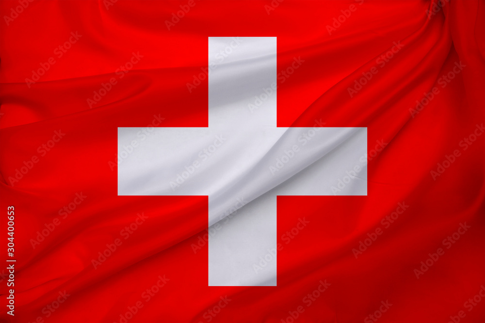 photo of beautiful colored national flag of modern state of Switzerland on textured fabric, concept of tourism, emigration, econom photo of beautiful colored national flag of modern state of Switzerland on textured fabric, concept of tourism, emigration, econom