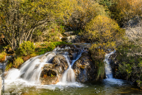 Fototapeta Naklejka Na Ścianę i Meble -  River in La Pedriza, in the mountains of Madrid, area characterized by large granite rocks