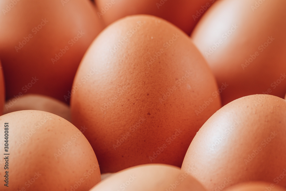 Close-up of an egg surrounded by more eggs. Close-up of an egg surrounded by more eggs.