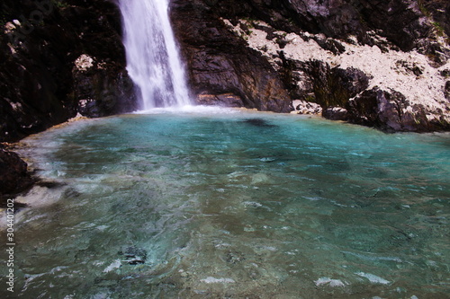 high waterfrall at the end of the path near Alleghe photo