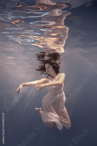 Wallpaper Mural Girl in a dress swims underwater Torontodigital.ca