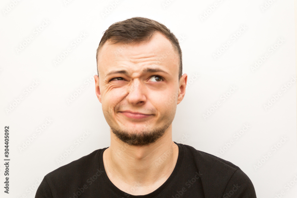 emotion wink, young man on a white background, human emoji emotion wink, young man on a white background, human emoji
