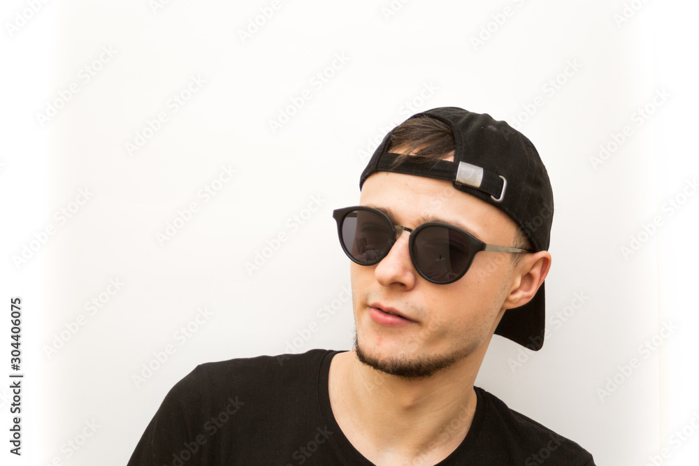 emotion serious, young man in black cap and black glasses on a white background, people emoji emotion serious, young man in black cap and black glasses on a white background, people emoji