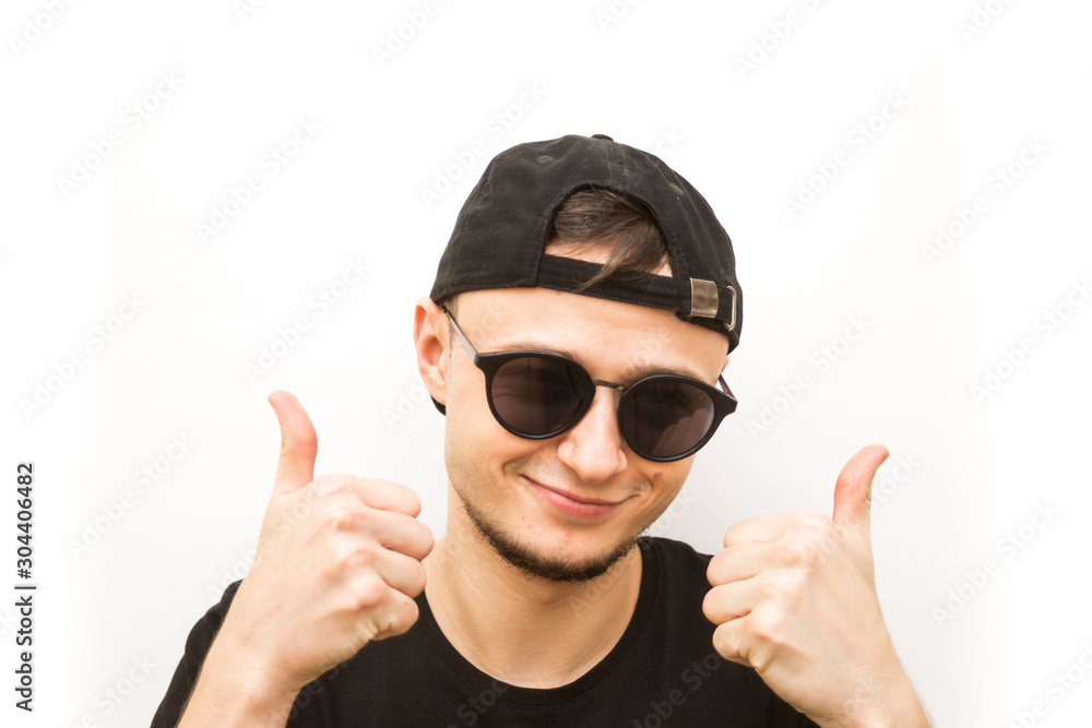 emotion fingers up the hill, young man in black cap and black glasses on a white background, people emoji emotion fingers up the hill, young man in black cap and black glasses on a white background, people emoji