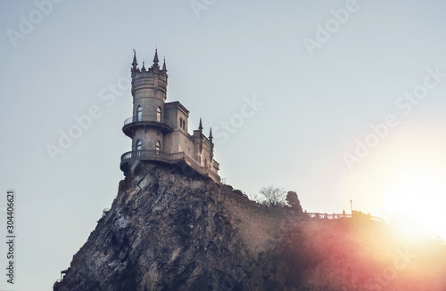 Swallow's Nest castle on the rock over the Black Sea on the sunset. Yalta. photo