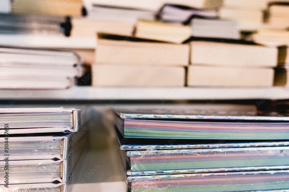 Books for sale on the shelves of a bookshop, viewed from above. Books for sale on the shelves of a bookshop, viewed from above.