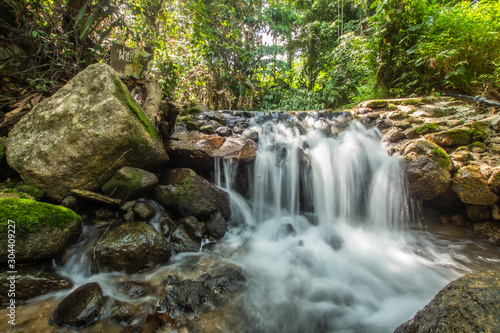 Fototapeta Naklejka Na Ścianę i Meble -  Kathu Waterfall in the tropical forest area In Asia, suitable for walks, nature walks and hiking, adventure photography Of the national park Phuket Thailand,Suitable for travel and leisure.