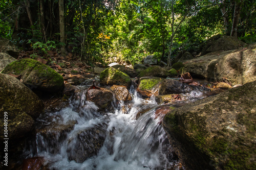 Kathu Waterfall in the tropical forest area In Asia, suitable for walks, nature walks and hiking, adventure photography Of the national park Phuket Thailand,Suitable for travel and leisure. © Stock.Foto.Touch