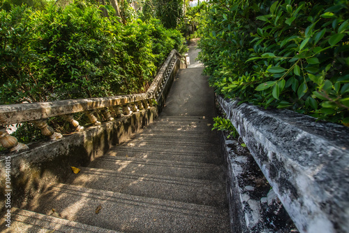 Kathu Waterfall  Phuket  Thailand. A forest path in a beautiful  abundant waterfall.