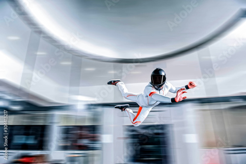 Fly Men. Levitation in wind tunnel. Indoor sky diving. Team flyers. Yoga fly in wind tunnel. Indoor skydiving. 