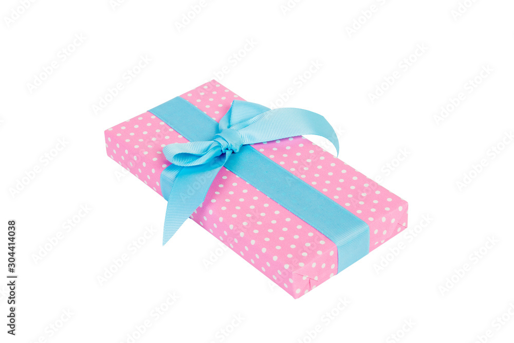 Fototapeta premium Christmas or other holiday handmade present in pink paper with blue ribbon. Isolated on white background, top view. thanksgiving Gift box concept