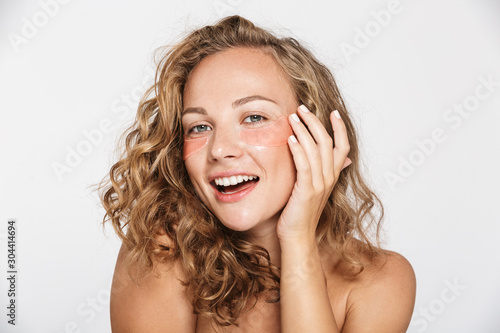 Print op canvas Image of happy half-naked woman smiling and looking at camera