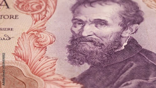 Wallpaper Mural Michelangelo Buonarroti portrait on vintage Italy lira banknote tracking macro. Genius Italian sculptor and painter. Slider shot. 4K stock video footage Torontodigital.ca