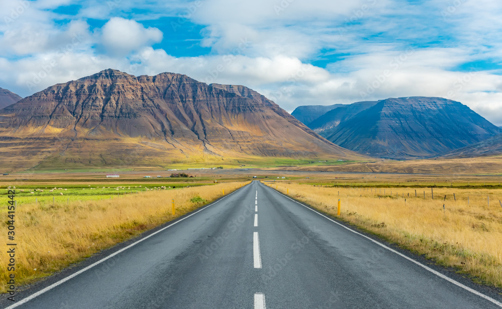 Iceland road landscape. Clouds and ocean on the horizon. Famous tourist attraction Iceland road landscape. Clouds and ocean on the horizon. Famous tourist attraction