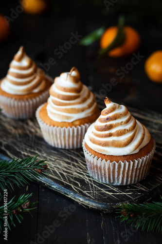 Photography Citrus cupcakes with lemon curls and a cap from Swiss meringue