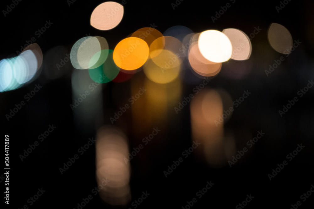Colorful bokeh light, reflecting in the water of a harbor Colorful bokeh light, reflecting in the water of a harbor