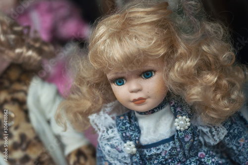 Closeup of vintage doll at flea market in the street